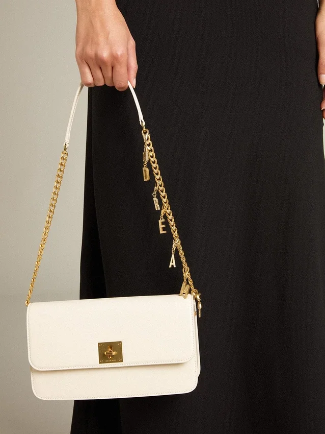 Sac Gioia en cuir gaufré couleur beurre avec détails dorés