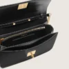 Sac Gioia en cuir noir rigide avec détails dorés