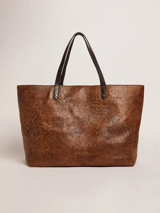 Sac Pasadena en cuir martelé à imprimé léopard et anses noires contrastantes