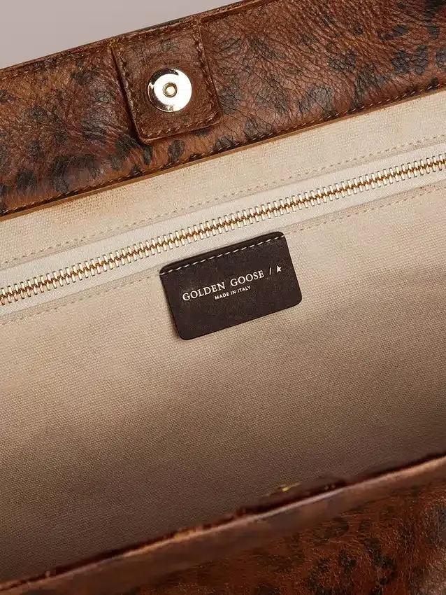 Sac Pasadena en cuir martelé à imprimé léopard et anses noires contrastantes