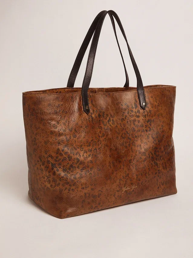 Sac Pasadena en cuir martelé à imprimé léopard et anses noires contrastantes