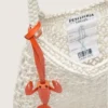 Sac pour femme en macramé, en coton couleur beurre, orné d’un pendentif en cuir en forme de homard