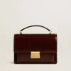 Sac Venezia en cuir laminé marron foncé avec détails dorés