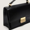 Sac Venezia en cuir noir gaufré avec détails dorés