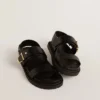 Sandales Lucy pour femme en cuir noir brillant avec boucle en métal doré