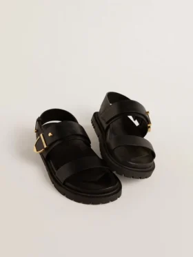 Sandales Lucy pour femme en cuir noir brillant avec boucle en métal doré