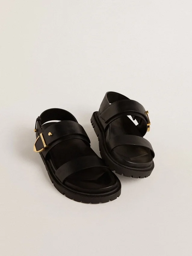 Sandales Lucy pour femme en cuir noir brillant avec boucle en métal doré