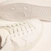 Sneakers Purestar pour femme avec languette de talon dorée