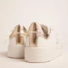 Sneakers Purestar pour femme avec languette de talon dorée