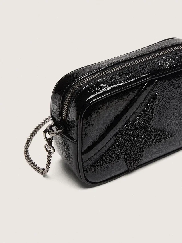 Star Bag en cuir noir orné d’une étoile en cristal Swarovski