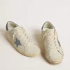 Super-Star avec étoile en cuir couleur crème ornée de cristaux Swarovski et languette de talon en cuir bleu à imprimé lézard