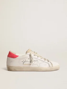 Super-Star en cuir blanc pour femme, avec étoile perforée et languette de talon en nylon fuchsia