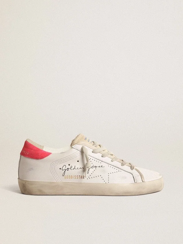 Super-Star en cuir blanc pour femme, avec étoile perforée et languette de talon en nylon fuchsia