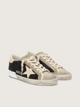 Super-Star en paillettes noires avec étoile crème et empiècements en daim