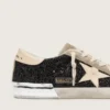 Super-Star en paillettes noires avec étoile crème et empiècements en daim