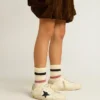 Super-Star Junior en cuir avec étoile pailletée et languette au talon