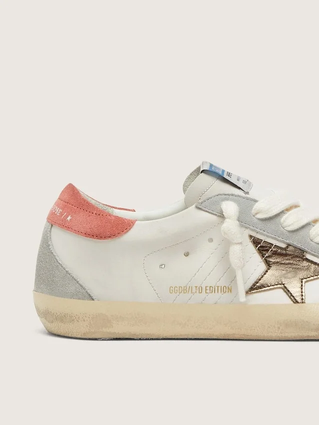 Super-Star LTD pour femme en cuir blanc avec étoile bronze métallisé
