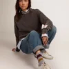 Super-Star pour femme avec bordure dorée pailletée et lettrage à clous métalliques