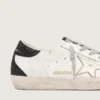 Super-Star pour femme avec étoile dorée et languette de talon à paillettes noires