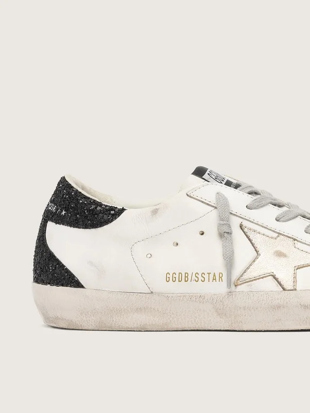 Super-Star pour femme avec étoile dorée et languette de talon à paillettes noires