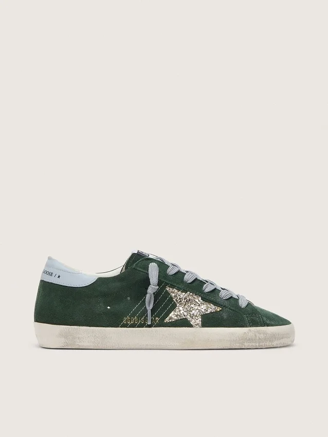 Super-Star pour femme en daim vert, avec étoile pailletée argentée et languette de talon en cuir