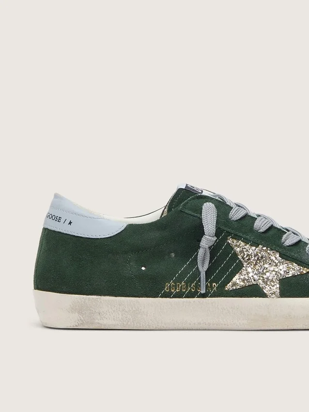 Super-Star pour femme en daim vert, avec étoile pailletée argentée et languette de talon en cuir