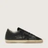 Super-Star pour femme en nappa noir avec étoile noire et languette de talon pailletée