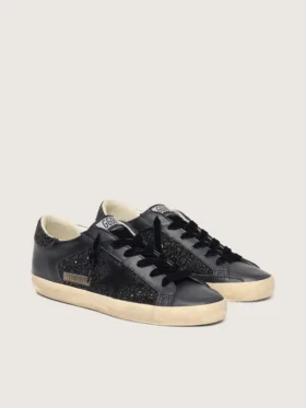Super-Star pour femme en paillettes noires avec étoile en daim noir et empiècements en cuir