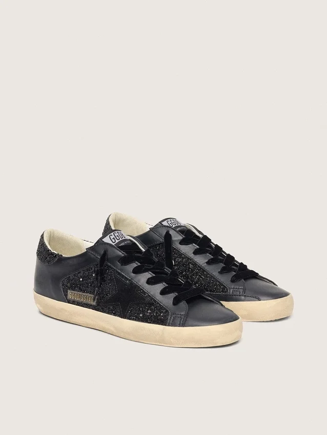 Super-Star pour femme en paillettes noires avec étoile en daim noir et empiècements en cuir