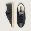 Super-Star pour femme en paillettes noires avec étoile en daim noir et empiècements en cuir