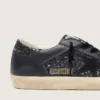 Super-Star pour femme en paillettes noires avec étoile en daim noir et empiècements en cuir