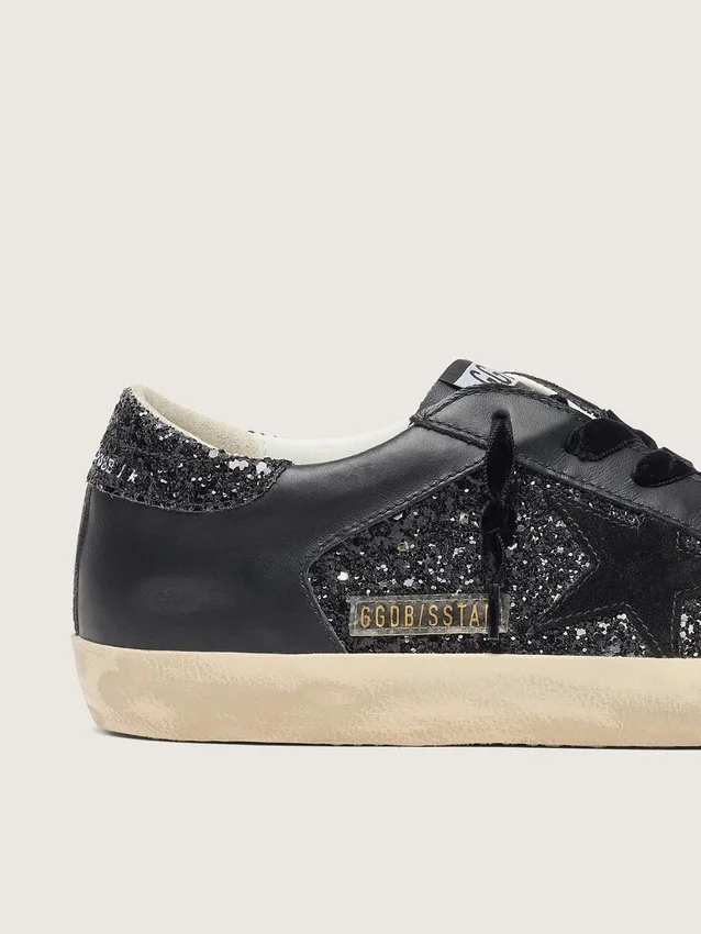 Super-Star pour femme en paillettes noires avec étoile en daim noir et empiècements en cuir