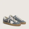 Super-Star pour homme en daim gris avec étoile en cuir blanc et languette de talon en cuir argenté