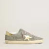 Super-Star pour homme en daim gris avec étoile en cuir métallisé doré et languette au talon