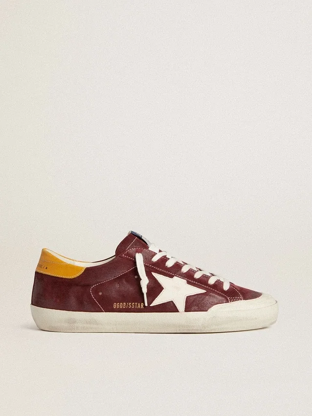 Super-Star pour homme en daim rouge brique avec étoile en cuir blanc et languette au talon à imprimé animalier