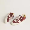 Super-Star pour homme en daim rouge brique avec étoile en cuir blanc et languette au talon à imprimé animalier