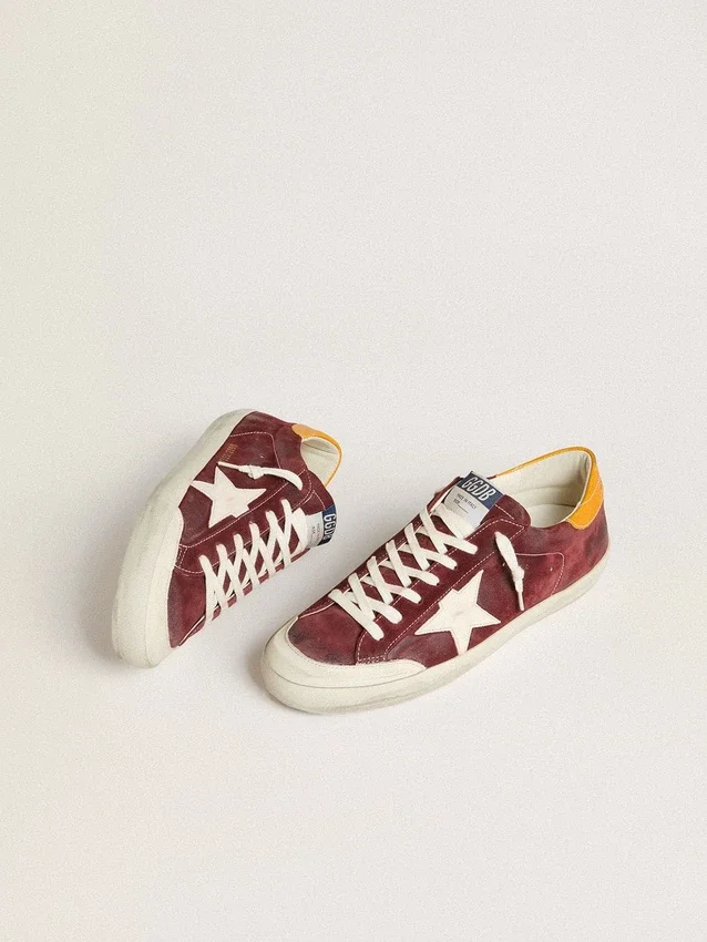 Super-Star pour homme en daim rouge brique avec étoile en cuir blanc et languette au talon à imprimé animalier