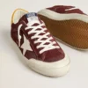 Super-Star pour homme en daim rouge brique avec étoile en cuir blanc et languette au talon à imprimé animalier