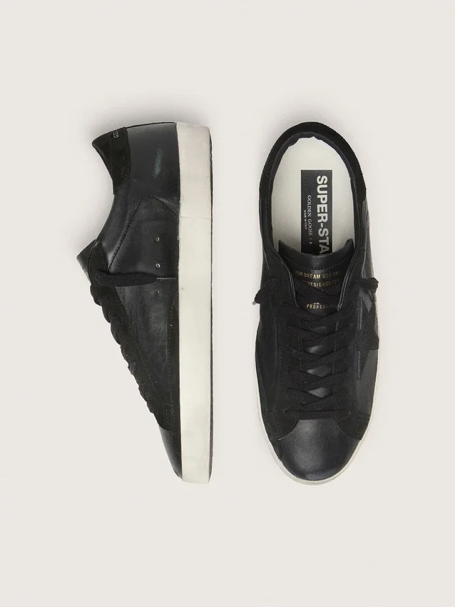 Super-Star pour homme en nappa noir avec étoile et languette de talon en daim noir