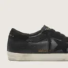 Super-Star pour homme en nappa noir avec étoile et languette de talon en daim noir