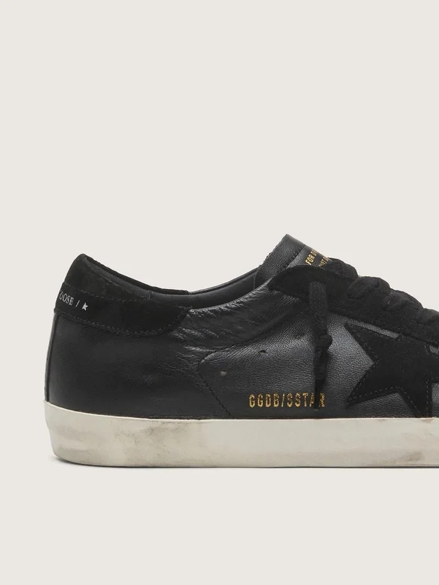 Super-Star pour homme en nappa noir avec étoile et languette de talon en daim noir