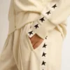 Sweat-shirt blanc à fermeture éclair pour femme, avec bande blanche et étoiles noires