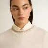 Sweat-shirt court en coton crème pour femme, orné de cristaux sur le devant