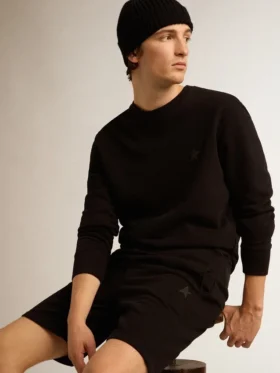 Sweat-shirt noir de la Star Collection avec une étoile ton sur ton sur le devant