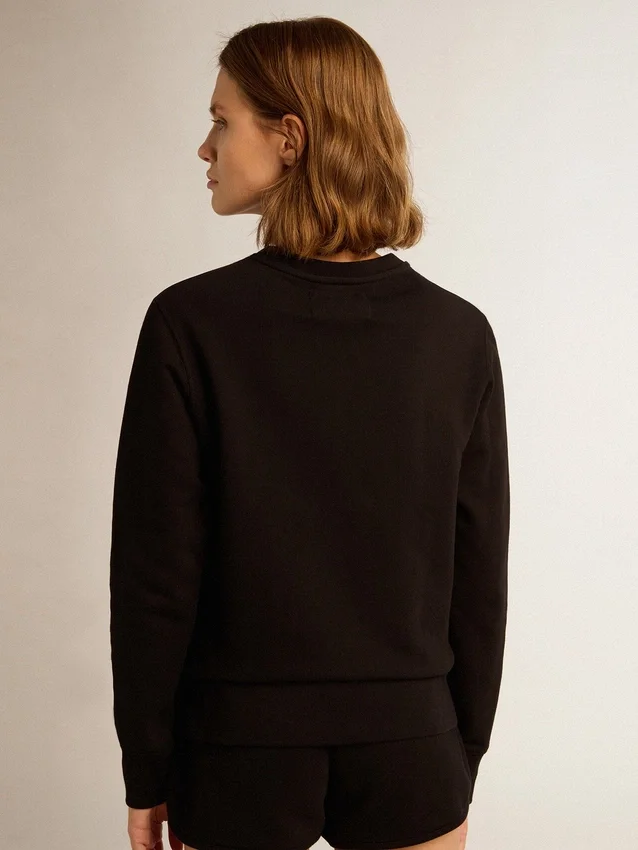 Sweat-shirt noir de la Star Collection avec une étoile ton sur ton sur le devant