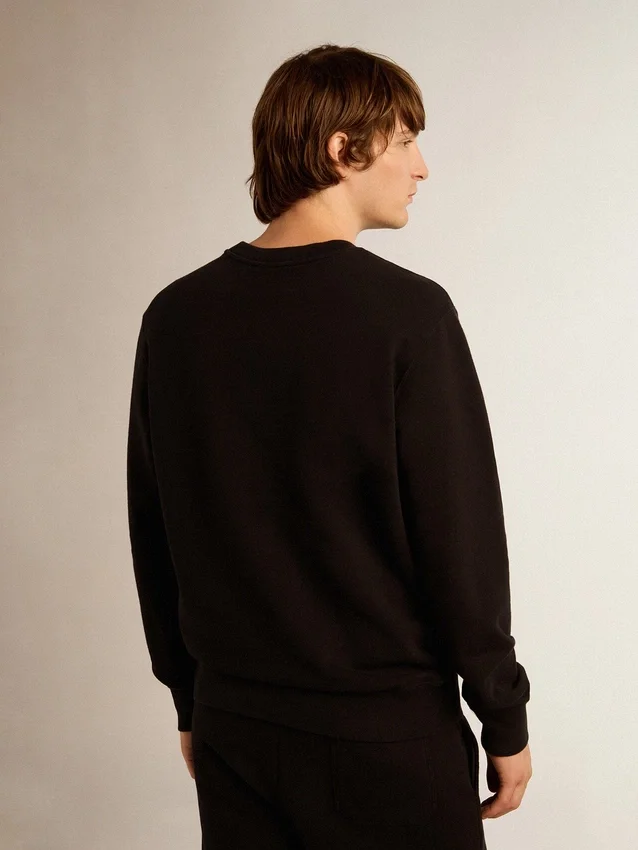 Sweat-shirt noir de la Star Collection avec une étoile ton sur ton sur le devant