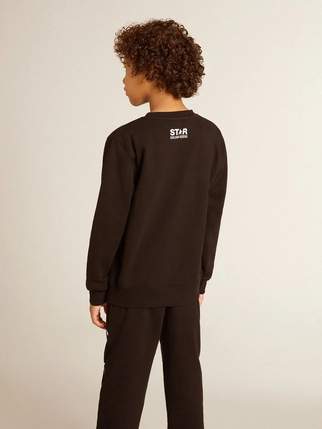 Sweat-shirt noir pour garçon avec une grande étoile blanche sur le devant