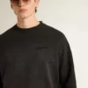 Sweat-shirt unisexe en coton noir délavé avec logo brodé