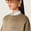 Sweat-shirt unisexe en coton vert militaire à l’aspect délavé avec logo brodé