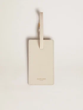 Étiquette de bagage blanche usée